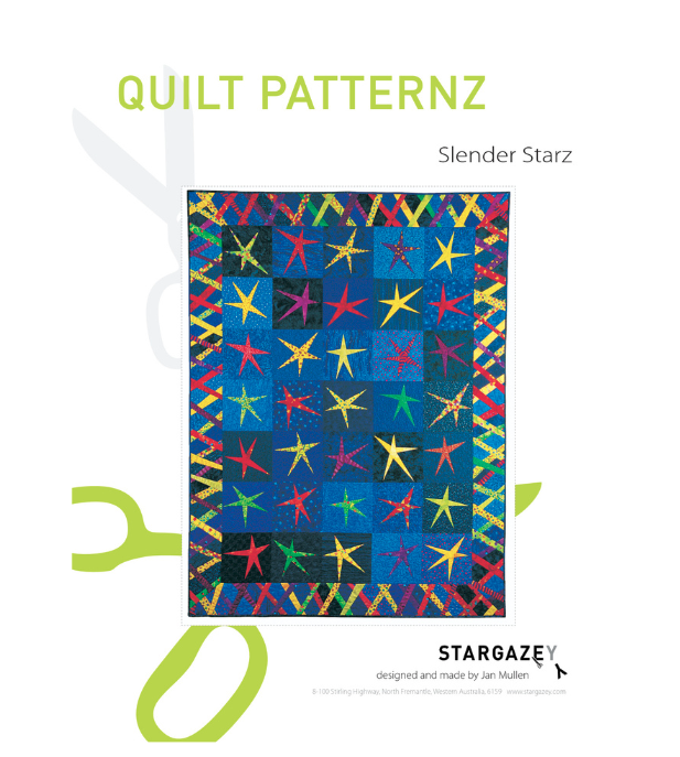 Colorful quilt pattern with star design on  blue patterned fabric.